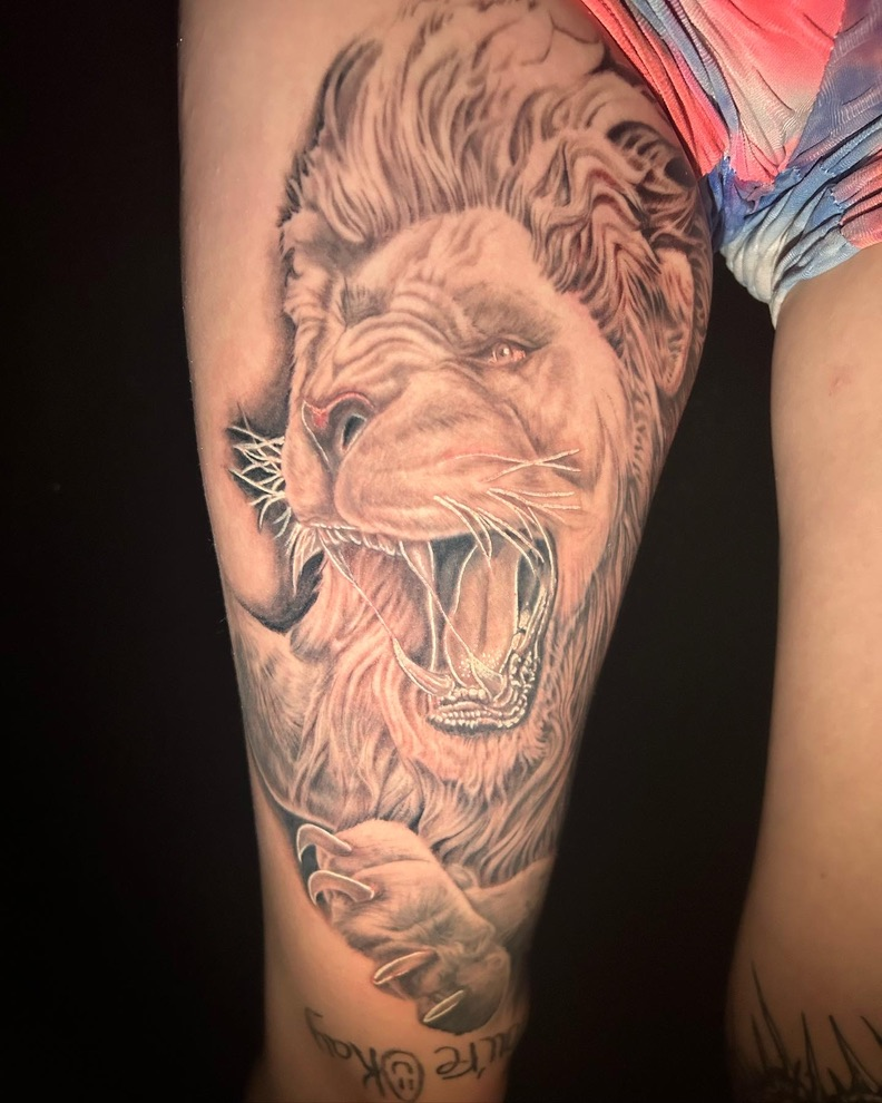 Fresh roaring lion thigh black and grey realism — Work of Art Las Vegas