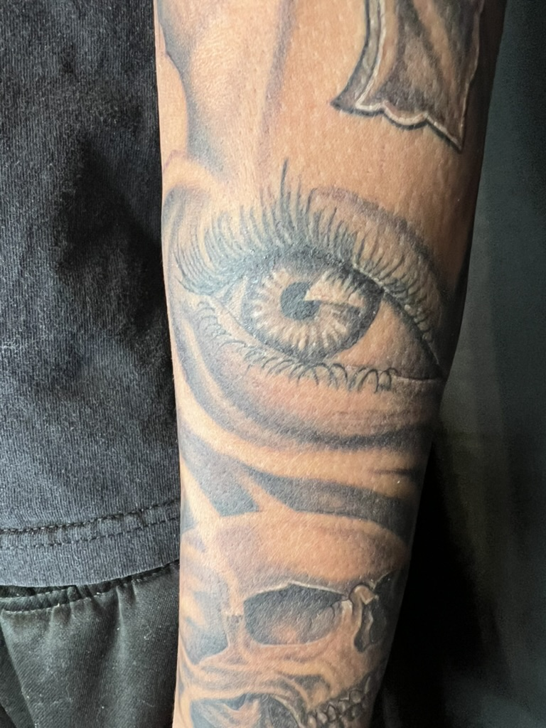 One-year healed cross eye skull forearm tattoo full length photo by Joshua Cole, Work of Art Las…, Work of Art Tattoo & Piercing, Las Vegas