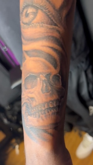 One-year healed skull and eye forearm close-up black and grey realism by Joshua Cole, Las Vegas, Work of Art Tattoo & Piercing, Las Vegas