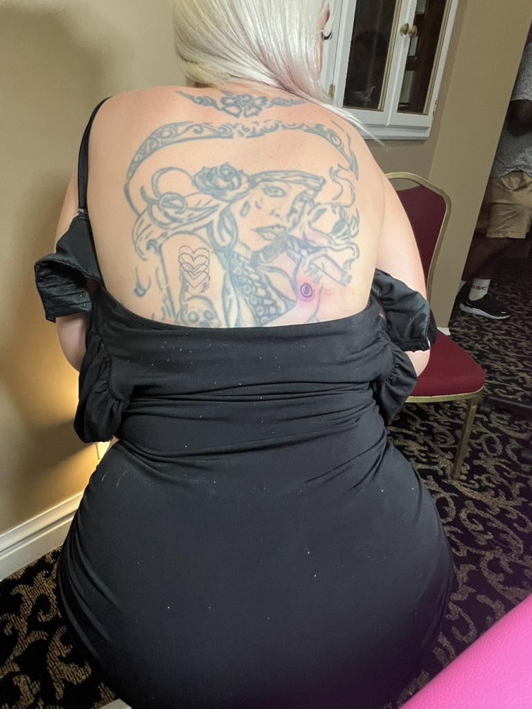 Fresh Bitcoin logo tattoo on shoulder beside faded black-grey back piece offsite — Joshua Cole…, Work of Art Tattoo & Piercing, Las Vegas