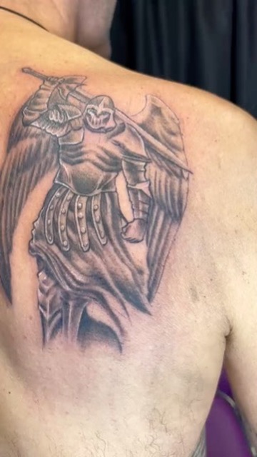 Black and grey armored archangel with wings and sword on upper back. — Joshua Cole, Work of Art…, Work of Art Tattoo & Piercing, Las Vegas