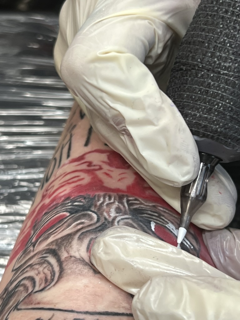 Illustrative demon tattoo session detail — Joshua Cole, Work of Art Las Vegas, Work of Art Tattoo & Piercing, Las Vegas