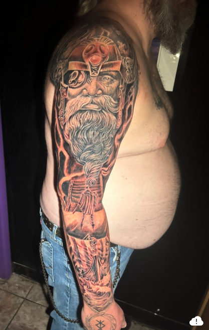 Full Norse sleeve — Odin portrait, longship, and runes with orange highlights — Joshua Cole…, Work of Art Tattoo & Piercing, Las Vegas