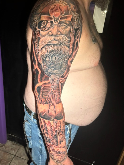 Norse Odin half sleeve with orange lightning — black and grey realism by Joshua Cole, Work of…, Work of Art Tattoo & Piercing, Las Vegas
