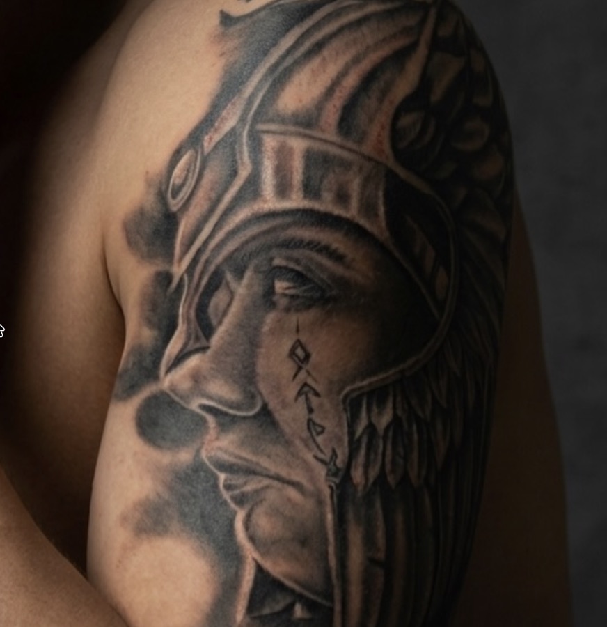 Profile Valkyrie in winged helmet with cheek runes on upper arm. — Joshua Cole, Work of Art Las…, Work of Art Tattoo & Piercing, Las Vegas
